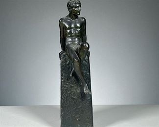 WHITE METAL MALE FIGURE  |  Nude male figure sitting atop a pedestal. 