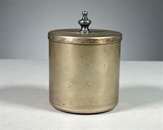 KENNETH LYNCH & SONS CONTAINER  |  Small metal container with jousting knight stamped in top.