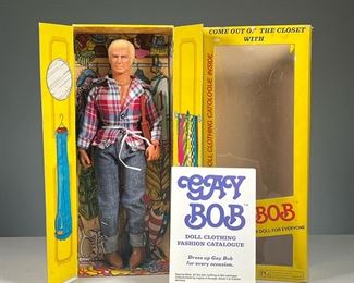 GAY BOB DOLL  |  Gay Bob doll in original packaging with original clothing fashion catalog. Dimensions: l. 2.5 x w. 5.5 x h. 13 in