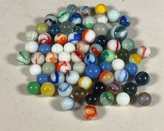 GLASS MARBLES  |  An assortment of colored glass marbles. 