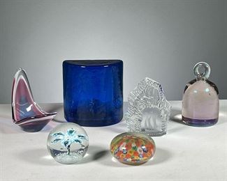 (6PC) GLASS PAPERWEIGHTS  |  Including a rock-form glass paperweight with etched ship, various colored glass paperweights, a Murano glass paperweight, and a floral domed paperweight. 