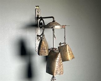HANGING BRASS BELLS  |  Set of hammered brass bells hanging from a central disk, illegibly marked on back. 