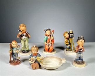 (6PC) HUMMEL & OTHER FIGURINES  |  Includes: 4 Hummel figures marked "W. Germany," including "Joyful" ashtray, musician "Sweet Music", & boy on phone "Hello". Plus other Hummel-style figures marked "Holland," including one with camera, and one chimney sweep boy. 