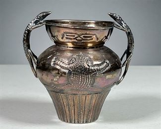 SILVER PLATED LIZARD VASE  |  Vase with double lizard handles and lizard carving on both sides, marked "TRP" in a shield on the bottom. Dimensions: h. 4 x dia. 4 in