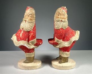 (2PC) PAIR PLASTER SANTA MODELS | Pair of plaster Santa figures with small shelf and notch in the back to hold something. Dimensions: w. 6 x h. 11.5 in
