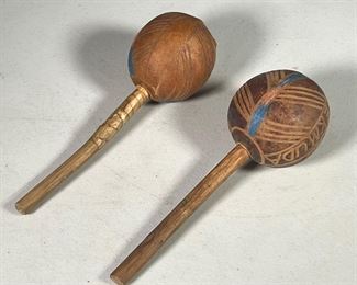 (2PC) CARVED WOODEN MARACAS | Carved & painted wooden maracas from Bermuda, carved from gourd. Dimensions: h. 9.5 x dia. 3 in