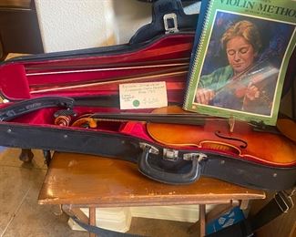 Stradivarius, with case 2 bows, chin holder and books of music