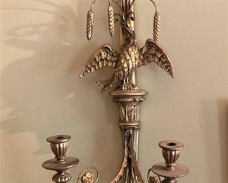 Gold toned wall sconce with an eagle