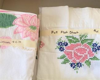Vintage linens with colorful handiwork