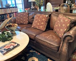 Leather sofa; marble top coffee table