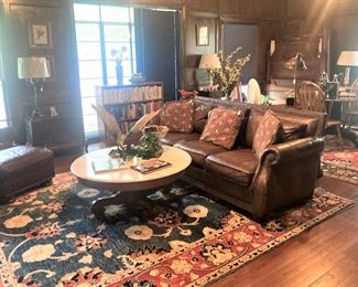 Another leather sofa and large rugs