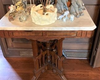 Marble top antique table; elephant collection