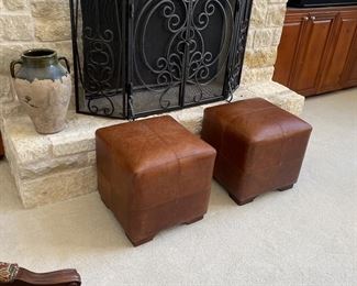 Two leather foot stools by Stanley furniture made in Brazil 