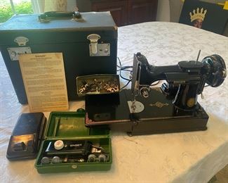 Featherweight, antique sewing machine with case and extra sewing parts
