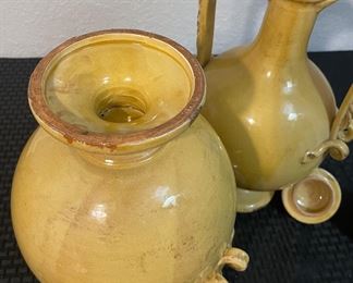 15	$100 	
2 matching glazed pottery urns yellow 	