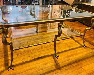 24	$500 	
Hollywood regency coffee table with griffon 57Lx38Tx24D	