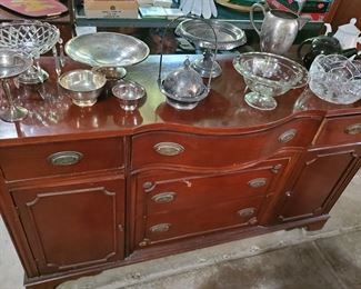 Solid wood sideboard along with some lovely crystal and antique silver 