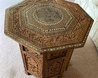 Ornate carved small table 