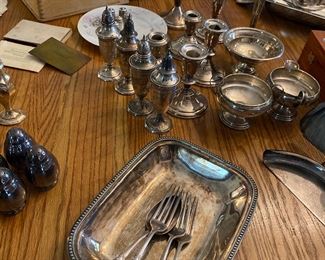 Sterling candle holders, slat and peppers, little dishes and wide assortment of silverplate 