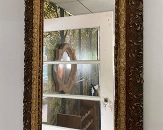 Ornate antique frame with mirror 