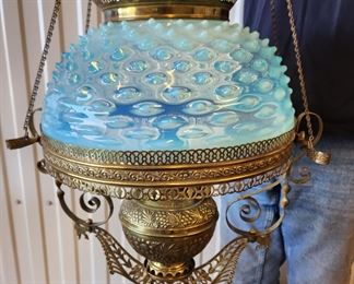A stunning 1880s Bradley & Hubbard Hanging Lamp. Has been electrified. Beautiful blue hobnail opalescent shade and approximately 61 prisms (not on the lamp in the photograph, but shown separately).  Has original retraction mechanism to raise and lower the lamp.