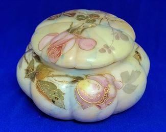 Antique Crown Milano glass covered melon shaped powder jar by the Mt. Washington Glass Company (Smith Brothers). The jar has 8 lobes, is 6" in diameter, and stands 3 3/4" tall with the cover in place. It is marked with the Lion trademark of Smith Brothers, the company that sold Mt. Washington products at the 1893 World's fair and other places. Excellent condition.