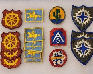 Lots of WW2 & WW1 items, including patches, insignia, uniforms, medals, photos, etc.