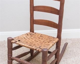 Wood child's rocking chair w/wicker woven seat:  $90.00
