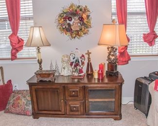 Left to right:  Drapes and curtains (2 panels and rug):  $48 ea. [2 available]  Pillow collection:  $8.00 - $24.00.  Brass Table Lamp:  $78.00.  Fleur de Lis Table lamp:  $88.00.  Console:  Solid wood Media Center/tv stand (25"h x 59"w x 20"d):  $160.00