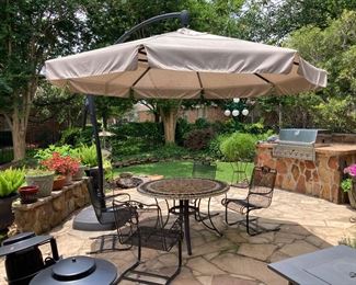 Patio table (29" h x 4' dia.):  $140.00 (as is)  Iron patio chairs.  Set of 2:  $260.00 (2 sets available)