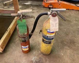 TWO FIRE EXTINGUISHERS