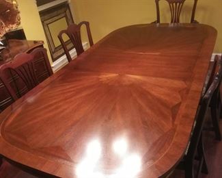 5ft dining table 2 leaves extend to 8ft. There are 5 chairs including 1 Captain's chair. Chairs free with purchase of table.