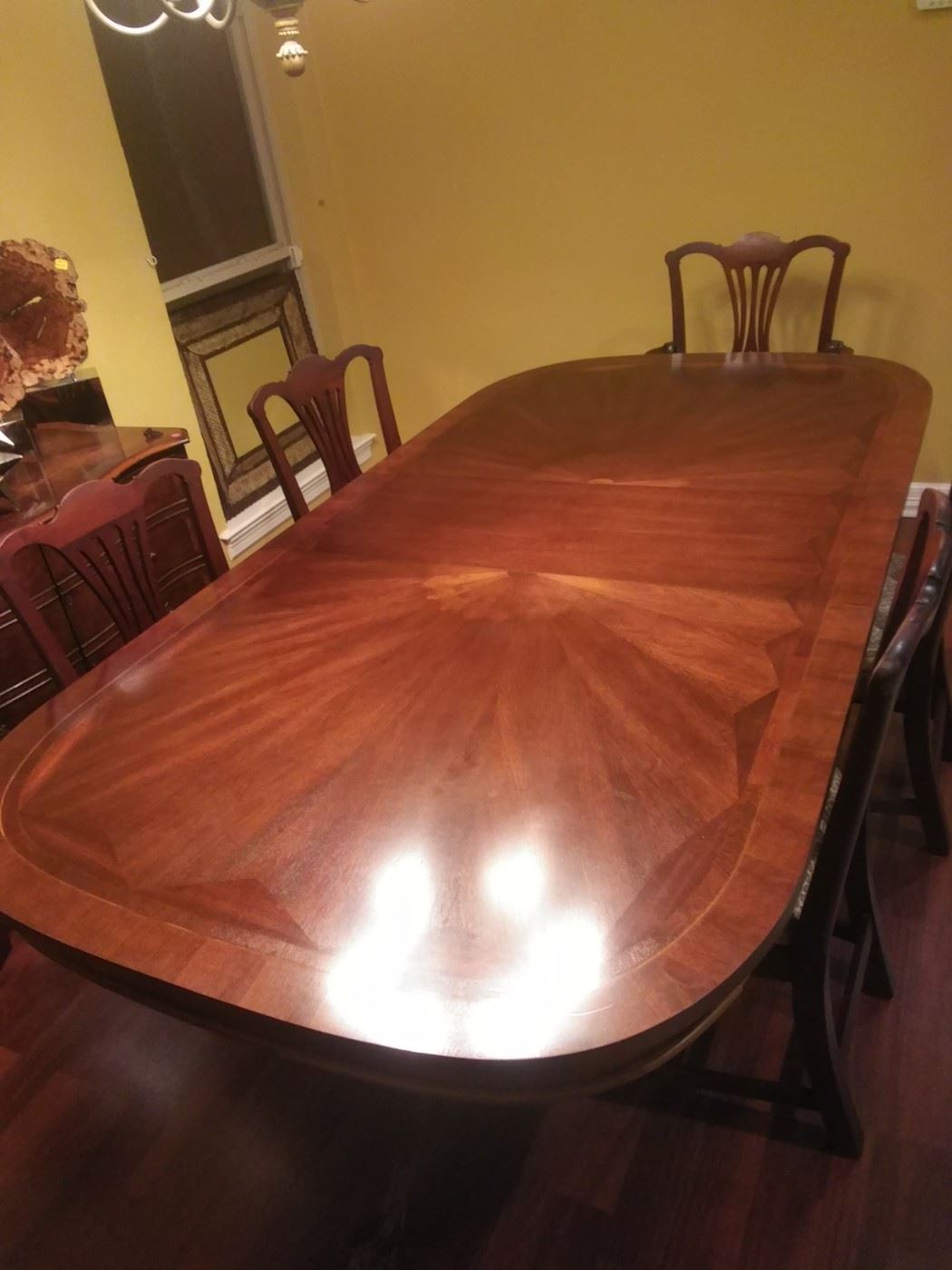 5ft dining table 2 leaves extend to 8ft. There are 5 chairs including 1 Captain's chair. Chairs free with purchase of table.