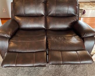 Leather reclining loveseat in a deep chocolate , great condition and so comfy