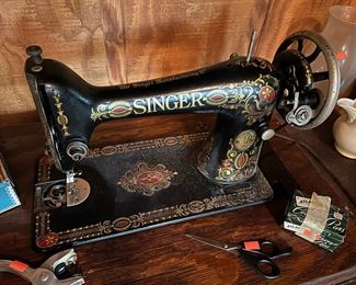 Antique Singer sewing machine in cabinet