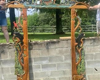 Gorgeous German Hand Carved Door Frame  for an inviting ambience when entering an home for Exterior or setting the mood for an Interior Doorway– It was purchased in Germany in the 90’s – wrapped and never unwrapped since purchasing and moved with them from place to place as they were world travelers. 
This magnificent hand carved door frame is carved from wood planks that are 16” in width and 2” thick. The Upper Carved Frame is 84” wide. The side panels are 82” tall interlocking with the Upper Frame making a height of 96” or 8’ and the width is 84” or 7’. Each panel is made of one solid piece of beautiful cedar. 
