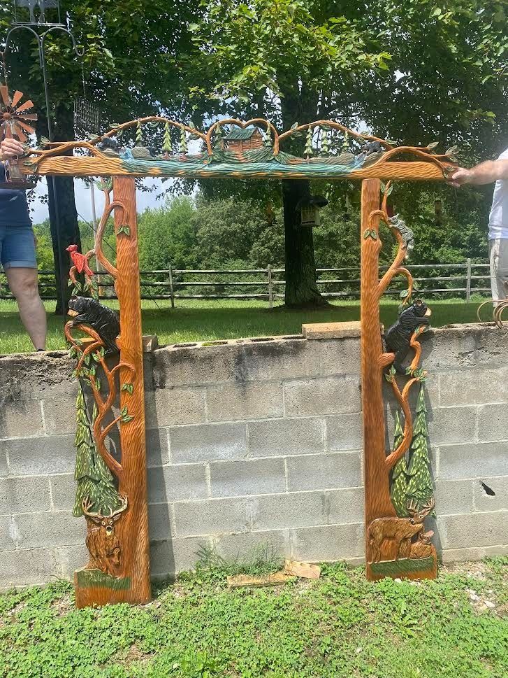 Gorgeous German Hand Carved Door Frame  for an inviting ambience when entering an home for Exterior or setting the mood for an Interior Doorway– It was purchased in Germany in the 90’s – wrapped and never unwrapped since purchasing and moved with them from place to place as they were world travelers. 
This magnificent hand carved door frame is carved from wood planks that are 16” in width and 2” thick. The Upper Carved Frame is 84” wide. The side panels are 82” tall interlocking with the Upper Frame making a height of 96” or 8’ and the width is 84” or 7’. Each panel is made of one solid piece of beautiful cedar. 
