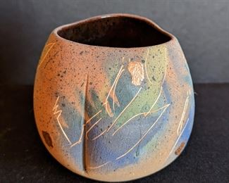 Small Raku Bowl by Laura Ross. Measures 3.5” high and 3” in diameter.