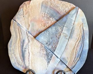 Unique Ceramic Wall Hanging by West Duby. Measures about 14” x 14”.