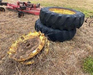 TWO TRACTOR RIMS AND WEIGHTED WHEEL CENTERS