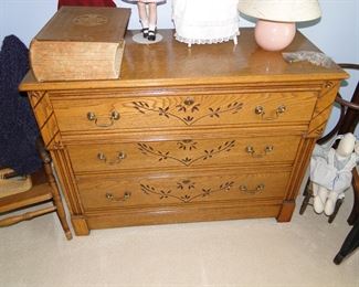 Solid oak, dresser.  And yes, the dresser is hand carved, with original hardware