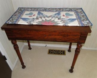 Smaller wooden occasional table and handmade quilt piece