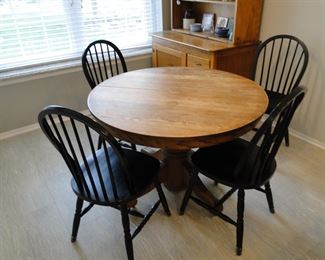 This round solid wood kitchen table and chairs are simply amazing