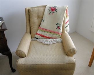 This smaller chair, which is very comfortable, is host to an amazing hand made throw