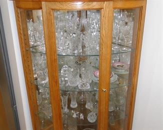 This vintage curio cabinet, with the arched glass doors, holds the real deal when it comes to Waterford Crystal, again, direct from Ireland