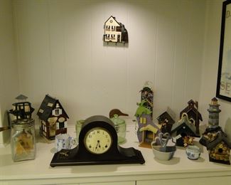Mantle clock and fun little birdhouses.  And yes, to the left is a small butter churn