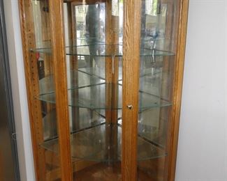 Beautiful arched glass curio cabinet, lighted