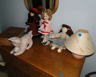 Dolls, mirror, lamp and antique dresser
