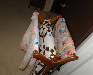 Handmade quilts, and large quilt stand