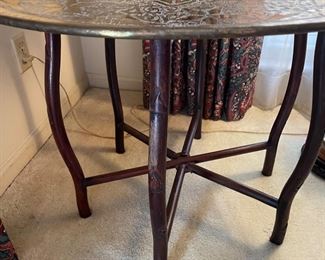 Moroccan  Brass tea table.    $ 300.00
Hand chased/hammered 30” diameter 24.5” T